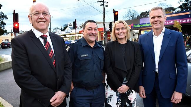 Community representatives Geoff Earney, Sergeant Richard Higgins, and Kristy Burrows with MP Tony Smith outside Mooroolbark railway station where CCTV cameras would help tackle crime. Picture: Steve Tanner