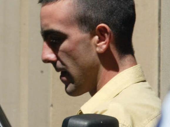 24/02/2003. Jason Joseph Roberts being lead from the Victorian Supreme Court in Melbourne, after being sentenced to a minimum term of 35 years, over 08/98 shooting murders of Sergeant Gary Silk and Constable Rodney Miller. Victoria / Crime / Murder P/L Picture: Richard Cisar-wright