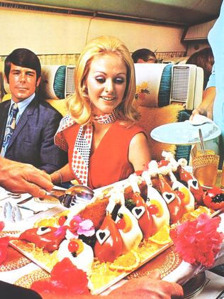 Dinner time on an Air New Zealand flight in the 1970s. Picture: Air New Zealand
