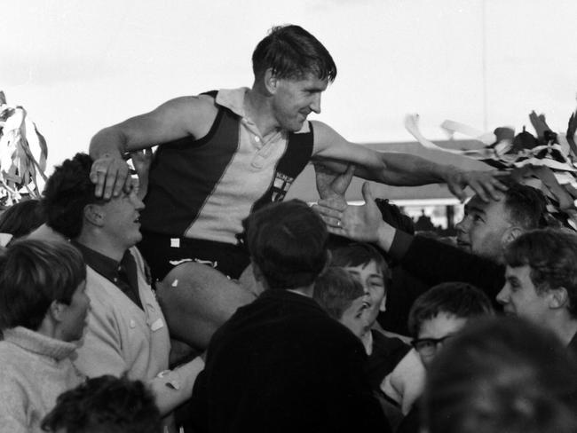 Playing coach Trevor Leo celebrates the New Norfolk Eagles' first-ever TFL grand final win, played against North Hobart at the North Hobart Oval in 1968.Mercury Historical Archive Collection