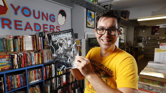 James Jagic holding a Moon Knight comic book at Comics Etc in the Brisbane CBD. Picture: Josh Woning