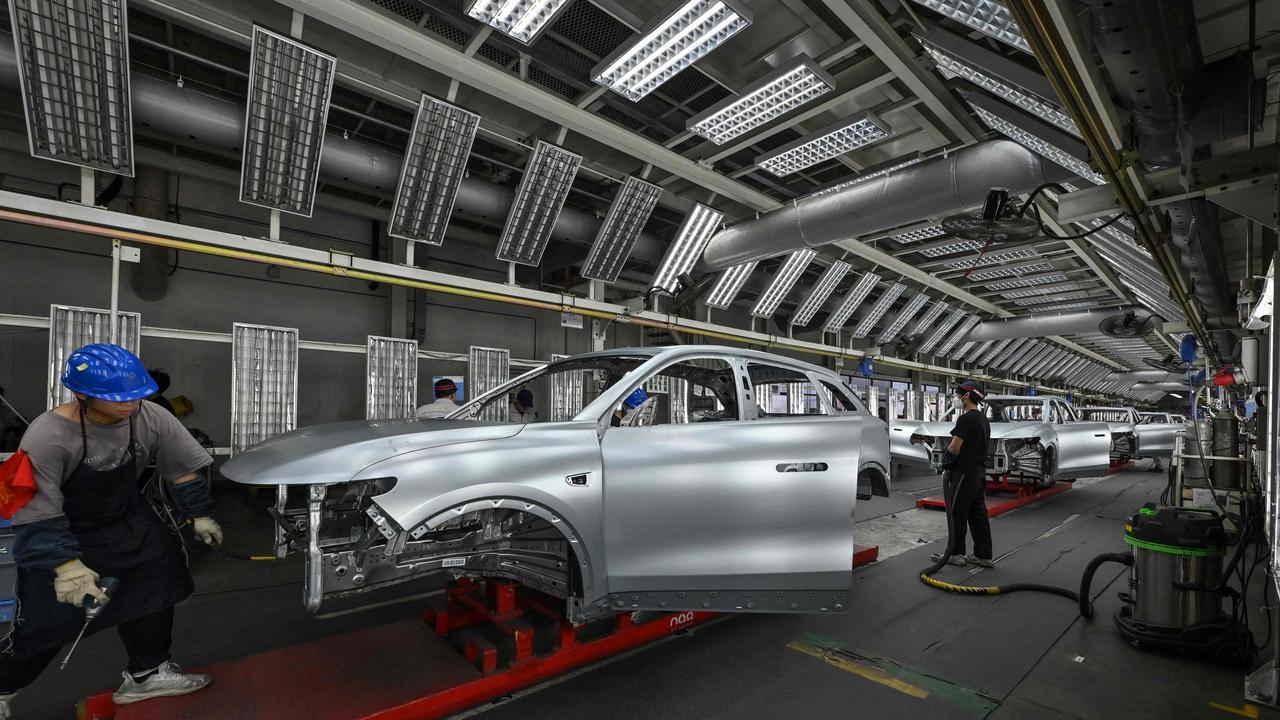 Employees work on an electric vehicle (EV) production line at the Leapmotor factory in Jinhua, China's eastern Zhejiang province. Picture: Adek BERRY / AFP