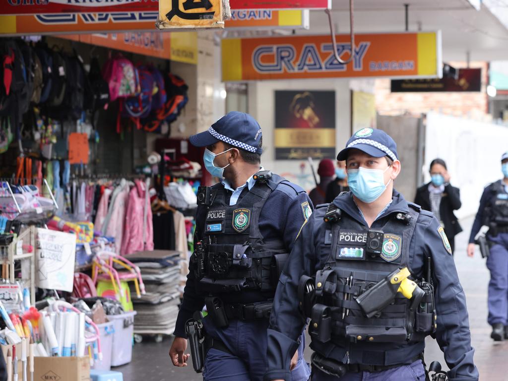 Police officers checking Covid compliance in Fairfield. Picture: NCA NewsWire / Damian Shaw
