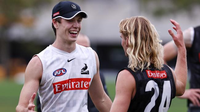 Oscar Steene celebrates with teammate Jakob Ryan after it was announced to the group he was rookie signed with the last spot on the Pies list. Picture: Michael Klein