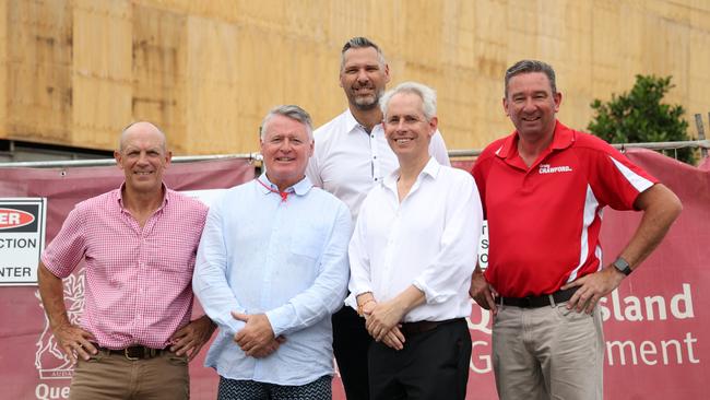 Labor Mulgrave candidate Richie Bates, Cairns MP Michael Healy, Labor Leichhardt candidate Matt Smith, federal skills and training minister Andrew Giles and Barron River MP Craig Crawford announce an additional 4100 fee-free TAFE placements for construction courses while visiting an 18 social home construction site in Cairns.