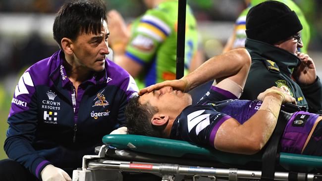 Billy Slater of the Storm is carried off after being knocked out during the Round 20 NRL match between the Canberra Raiders and the Melbourne Storm at GIO Stadium in Canberra, Saturday, July 22, 2017. (AAP Image/Mick Tsikas) NO ARCHIVING, EDITORIAL USE ONLY