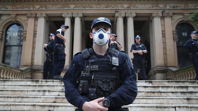 Police are in position at Sydney Town Hall this afternoon. Picture: David Swift