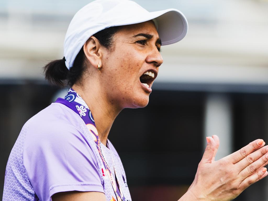 New Queensland Firebirds coach Kiri Wills urges her players on in pre-season fitness training. Photo: Trent Schwarz/Netball Queensland