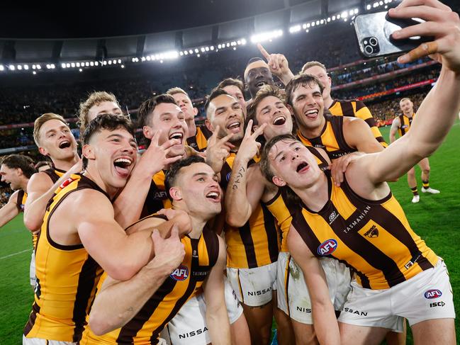 MELBOURNE, AUSTRALIA - SEPTEMBER 06: Calsher Dear of the Hawks takes a selfie with teammates during the 2024 AFL Second Elimination Final match between the Western Bulldogs and the Hawthorn Hawks at The Melbourne Cricket Ground on September 06, 2024 in Melbourne, Australia. (Photo by Dylan Burns/AFL Photos via Getty Images)