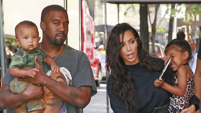 The couple with their 2 kids, North and Saint.
