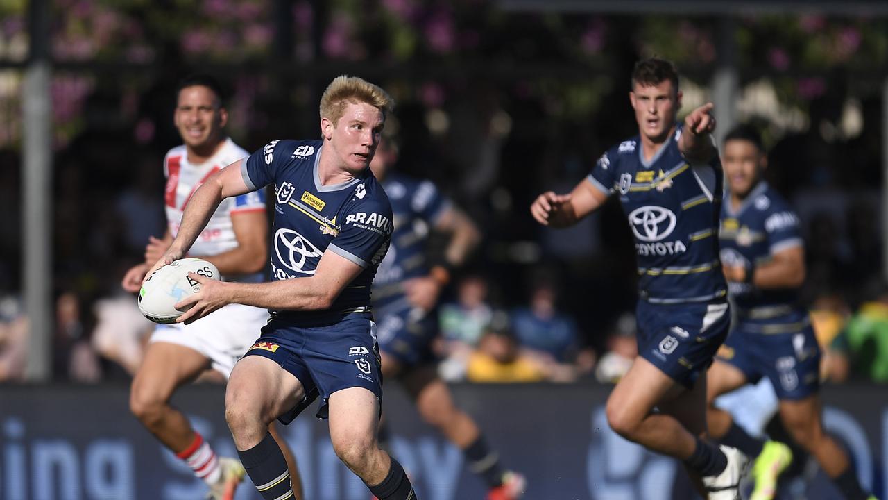 ROCKHAMPTON, AUSTRALIA - AUGUST 28: Tom Dearden of the Cowboys passes the ball during the round 24 NRL match between the St George Illawarra Dragons and the North Queensland Cowboys at Browne Park, on August 28, 2021, in Rockhampton, Australia. (Photo by Ian Hitchcock/Getty Images)