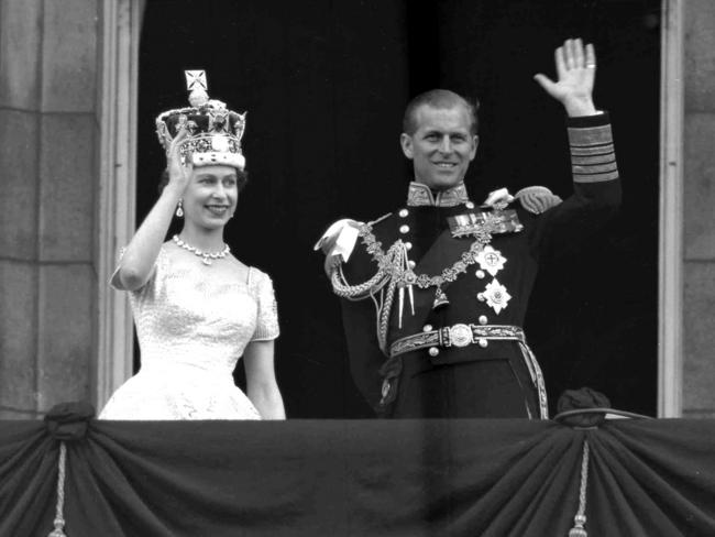 Queen Elizabeth II and Prince Philip, Duke of Edinburgh, as they wave to supporters from the balcony at Buckingham Palace, following her coronation at Westminster Abbey. Picture: AP