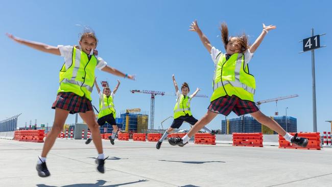 Lindisfarne Anglican Grammar School year three students at the Gold Coast airport ready to name the cranes. Ivy Thomson, Wallace Thompson, Archie Wilson and Sana Rice.