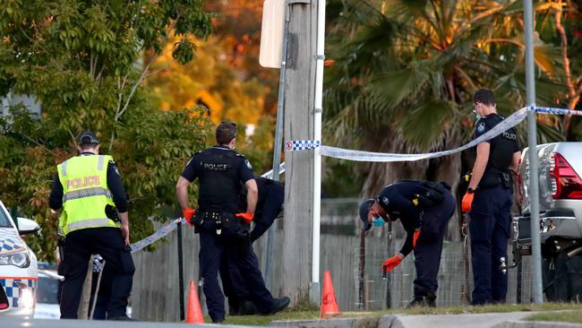 Police outside an Old Logan Road house in Gailes on Saturday where Ipswich man Christopher Anderson was shot dead.