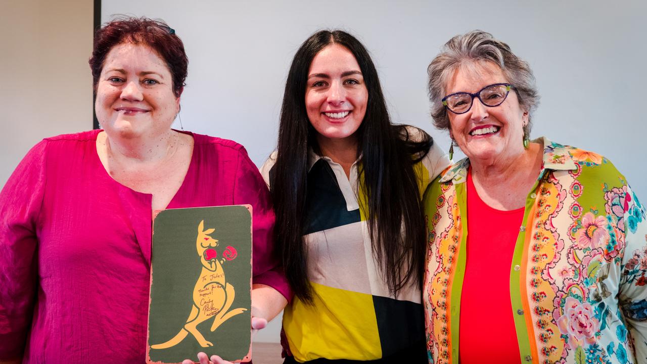 Parker (middle) with the lucky winners of one of her raffle prizes. Picture: Archivist Media