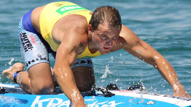 Ironman Dean Mercer competes in the Coolangatta Gold race on Gold Coast in Queensland.