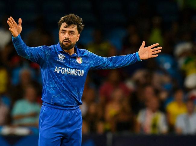 Afghanistan's captain Rashid Khan appeals for a wicket during the ICC men's Twenty20 World Cup 2024 Super Eight cricket match between Afghanistan and Australia at Arnos Vale Stadium in Arnos Vale, Saint Vincent and the Grenadines on June 22, 2024. (Photo by Randy Brooks / AFP)