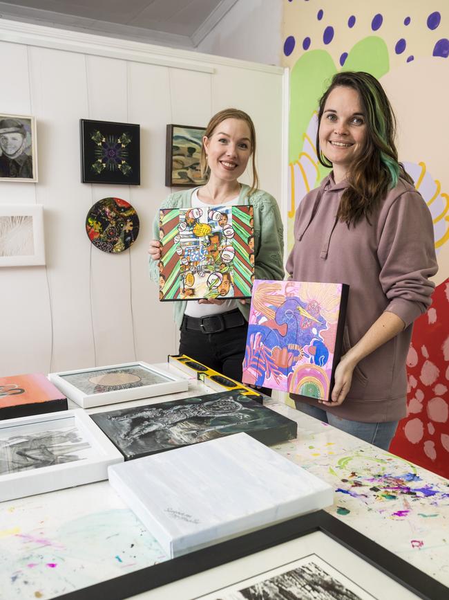 Elysha Rei (left) and Alex Stalling prepare for the Made. Reunion Show featuring 20 artists who exhibited with Made Creative Space between 2011 and 2013. Picture: Kevin Farmer