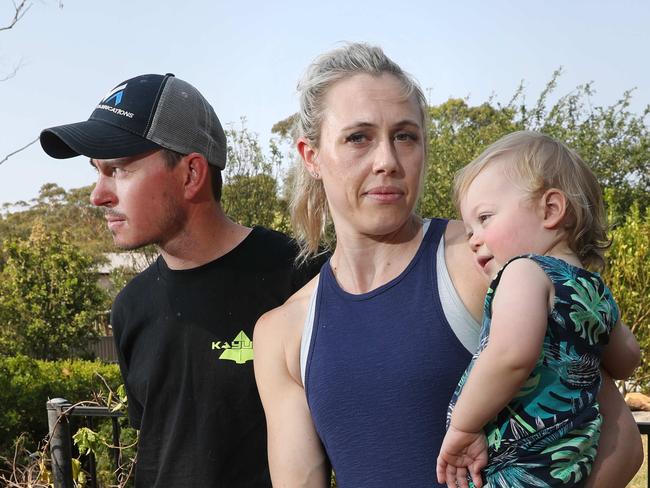 Pictured at the family home at Bowen Mountain is Matt and Kate Milgate with their son Rueben. They are preparing to leave if the current bushfire situation worsens. Picture: Richard Dobson