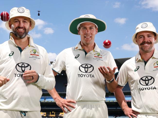 Nathan Lyon, Scott Boland and Travis Head wearing the Shane Warne Legacy cricket hats. Picture: David Caird