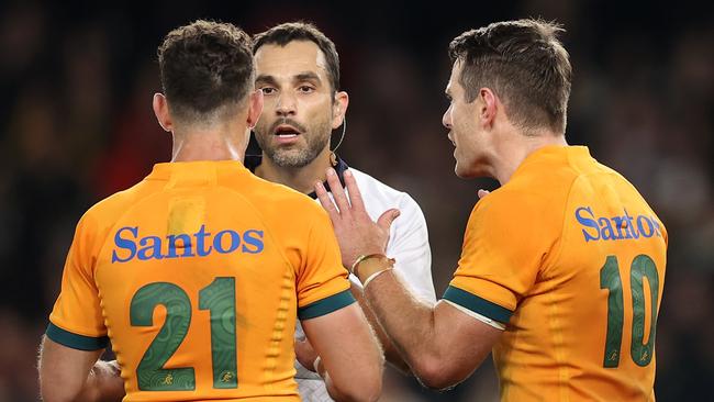 MELBOURNE, AUSTRALIA - SEPTEMBER 15: Referee Mathieu Raynal speaks to Nic White and Bernard Foley of the Wallabies during The Rugby Championship &amp; Bledisloe Cup match between the Australia Wallabies and the New Zealand All Blacks at Marvel Stadium on September 15, 2022 in Melbourne, Australia. (Photo by Cameron Spencer/Getty Images)