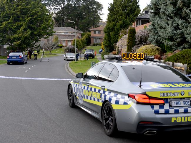 Homicide detectives at the scene. Picture: Andrew Henshaw