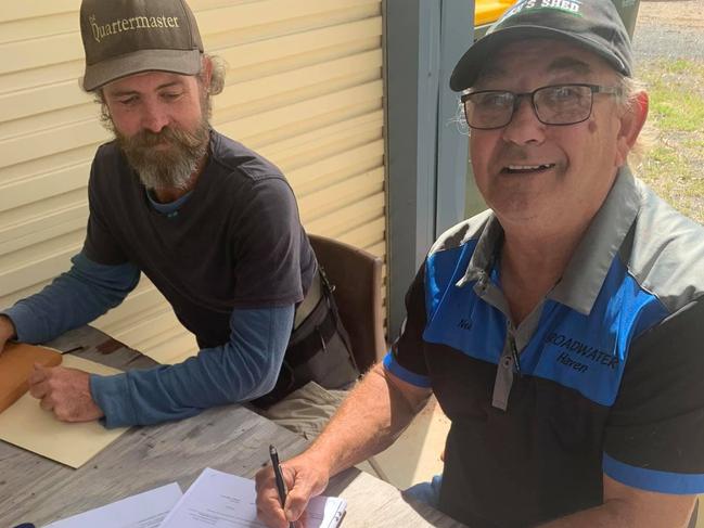 Baffle Creek Men's Shed members celebrate a monumental moment in the organisations history, the signing of a lease with Gladstone Regional Council for land to erect their new shed on.