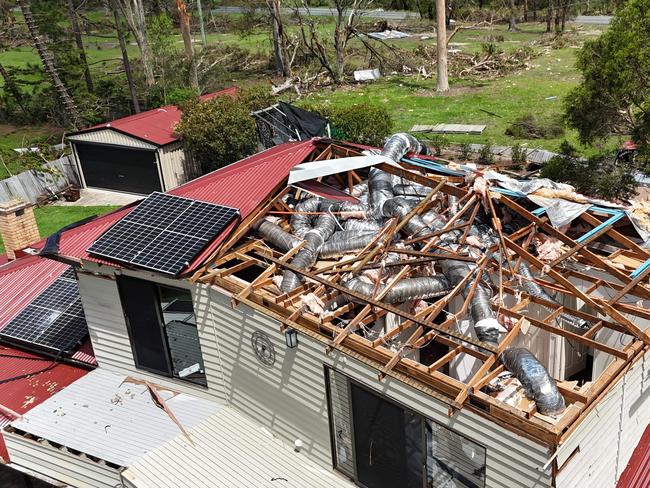 Storm recovery at Oxenford. Adam Baileys house on California Drive lost its roof. Picture Glenn Hampson