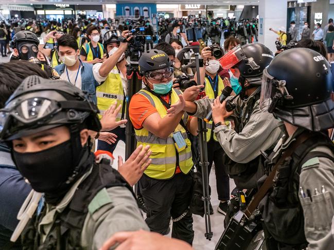 Riot police stand off with member of the press in a shopping mall during Labor Day on May 1, 2020 in Hong Kong, China. Picture: Anthony Kwan/Getty Images