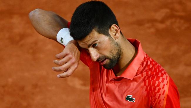 PARIS, FRANCE - MAY 31: Novak Djokovic of Serbia reacts against Marton Fucsovics of Hungary during the Men's Singles Second Round Match on Day Four of the 2023 French Open at Roland Garros on May 31, 2023 in Paris, France. (Photo by Clive Mason/Getty Images)