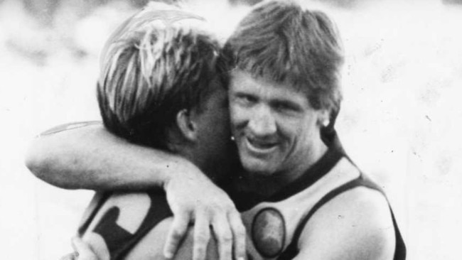 Chris McDermott with former Glenelg teammate Scott Salisbury. Bone has looked back on 50 years of SANFL memories and named his favourite 25 players.