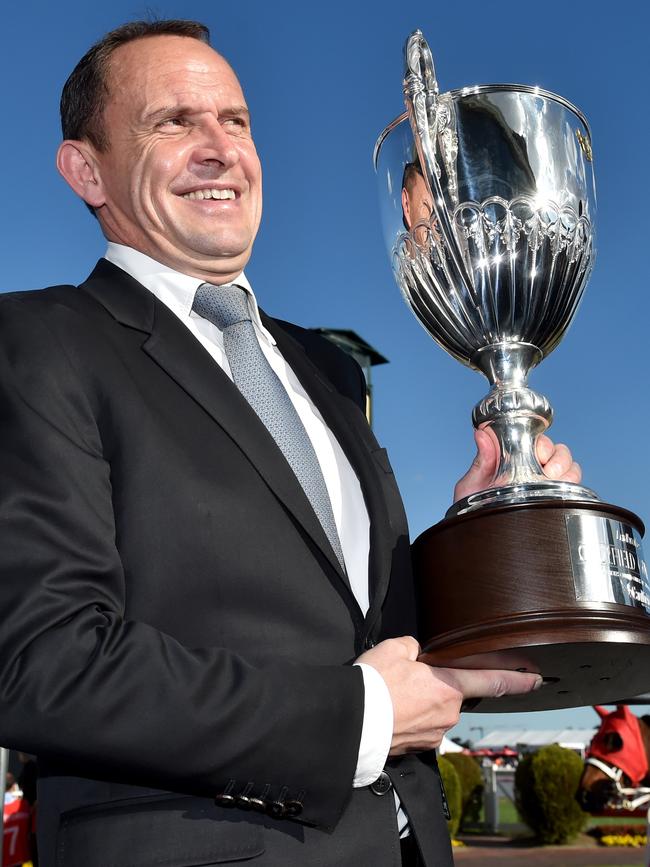 Trainer Chris Waller poses with the Caulfield Guineas trophy. Picture Jay Town