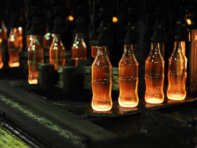 5 Andrews Road , Cranebrook , Western Sydney.  The O-I Glass factory has received an industry award from Sydney Water along with a five-star rating for their water reduction program.  Pictured LTR:  Freshly made red hot glass bottles
