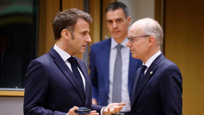 France's President Emmanuel Macron and Luxembourg's Prime Minister Luc Frieden speak at a European Union Summit in Brussels on Thursday. Picture: Ludovic Marin / AFP