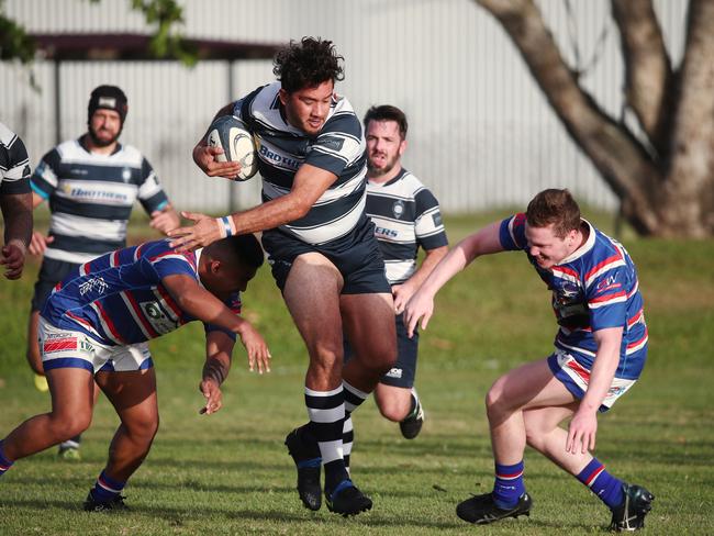 Brothers' Jody Healey pushes his way through the Bulls. PICTURE: BRENDAN RADKE