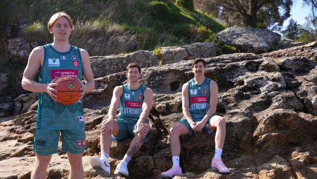 Tasmania JackJumpers players Brody Nunn (front), Will Magnay (back left) and Lachie Barker (back right) in the club's NBL Indigenous Round jersey. Picture: Tasmania JackJumpers.