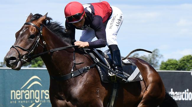 Supergiant (inside) shades The Candy Man in a gallop at the Gold Coast yesterday. Picture: Trackside Photography