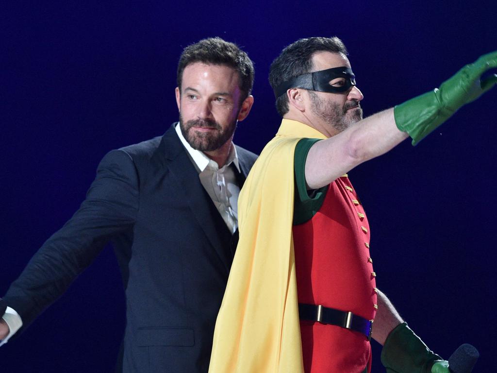 Ben Affleck and Jimmy Kimmel wave as they walk off stage after speaking during the taping of the concert to raise funds to ensure global vaccine access. Picture: Valerie Macon / AFP