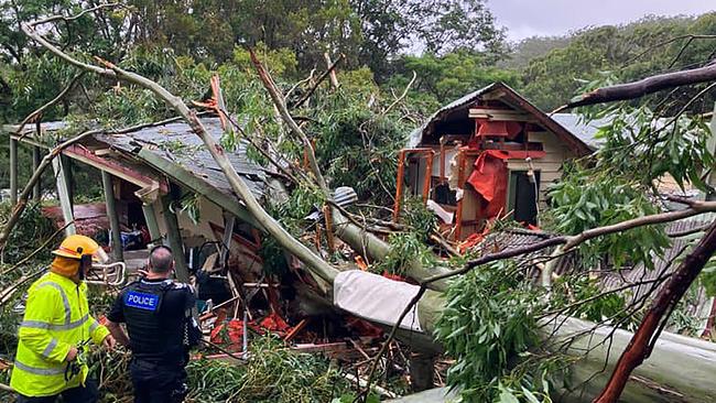 A large gum tree crashed into a Currumbin Valley home at the Gold Coast on Friday after strong winds ahead of Tropical Cyclone Alfred: Picture: Queensland Ambulance Service/Facebook.