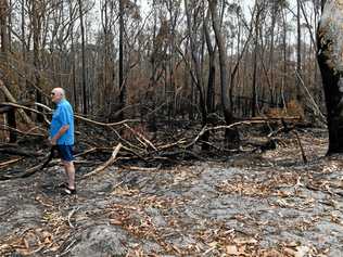 Geoff MacOibicin stands at his home where fire threatened homes at Wardell when it pushed right up to the back of properties at Lindsay Crescent. Picture: Marc Stapelberg