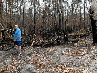 Geoff MacOibicin stands at his home where fire threatened homes at Wardell when it pushed right up to the back of properties at Lindsay Crescent. Picture: Marc Stapelberg