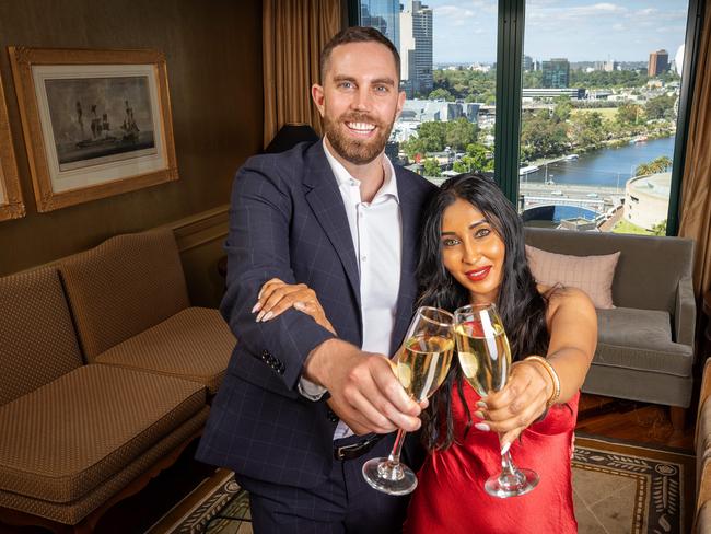 Cameron McKenzie and Maheesha Kariyawasam toasting the end of 2021 at The Langham. Picture: Mark Stewart