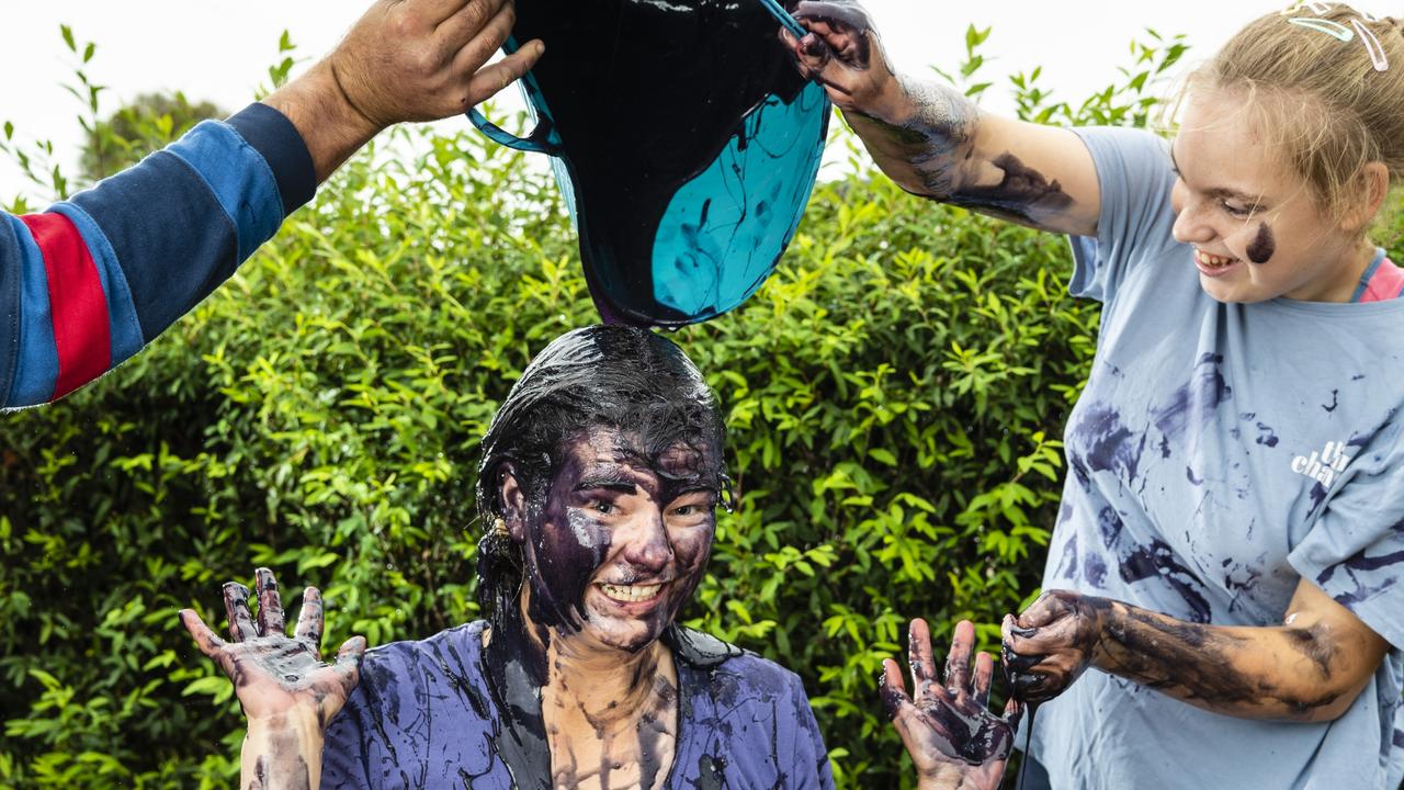 SLIMY INSPIRATION: Chloe Bradford is covered in slime by her younger sister Bridie Bradford, as she raises money for Eplilepsy Awareness, Monday, March 28, 2022. Picture: Kevin Farmer