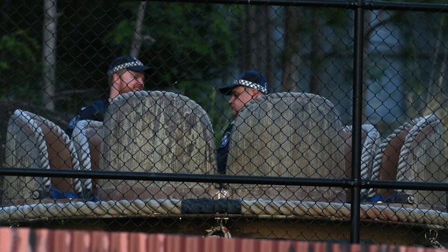 Police next to a raft similar to the one in which four people died in an incident at Dreamworld. Picture: Regi Varghese