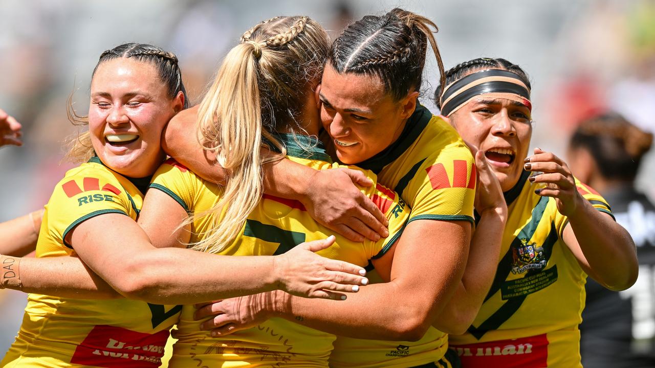 SYDNEY, AUSTRALIA - NOVEMBER 10: Tarryn Aiken of Australia celebrates with teammates after scoring a try during the 2024 Pacific Championships Pacific Cup Women's Final match between Australia Jillaroos and New Zealand Kiwi Ferns at CommBank Stadium on November 10, 2024 in Sydney, Australia. (Photo by Izhar Khan/Getty Images)