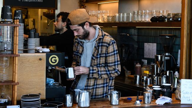 A barista works at a cafe near Bondi Beach in Sydney. Picture: File