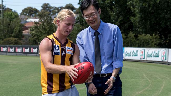 Box Hill Hawks player Billy Murphy with Dr Jiun Ying Lai.