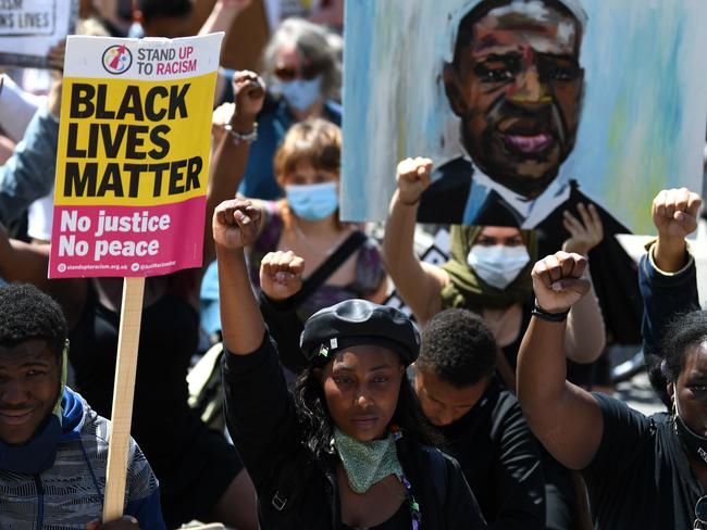 Protesters Take The Knee in support of the Black Lives Matter movement as they march in London on Saturday (local time). Picture: AFP