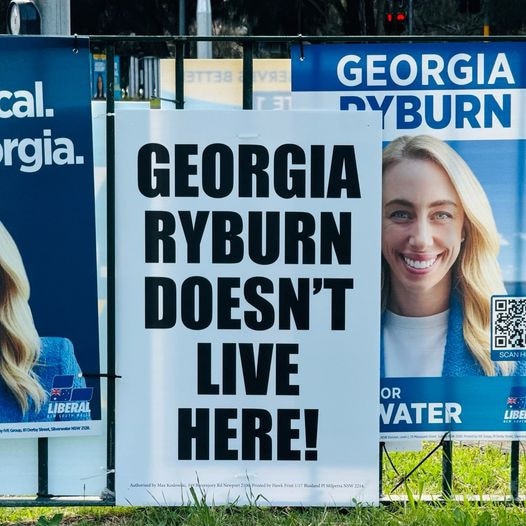 A placard placed over campaign posters for Georgia Ryburn, the Liberal candidate in the Pittwater state by-election. Picture: Facebook