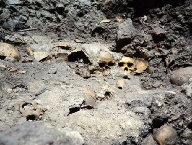 In this May 30, 2015 photo released by Mexico’s National Institute of Anthropology and History (INAH), skulls are partially unearthed at the Templo Mayor Aztec ruin site in Mexico City. Picture: Hector Montano